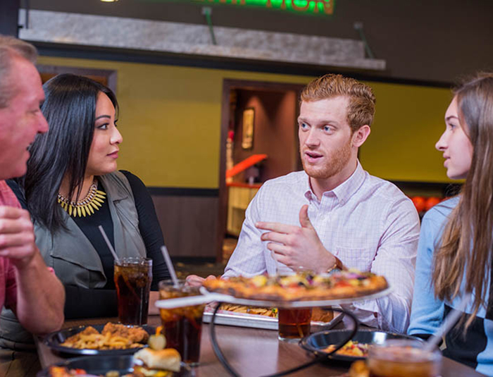 Group of people at a table talking